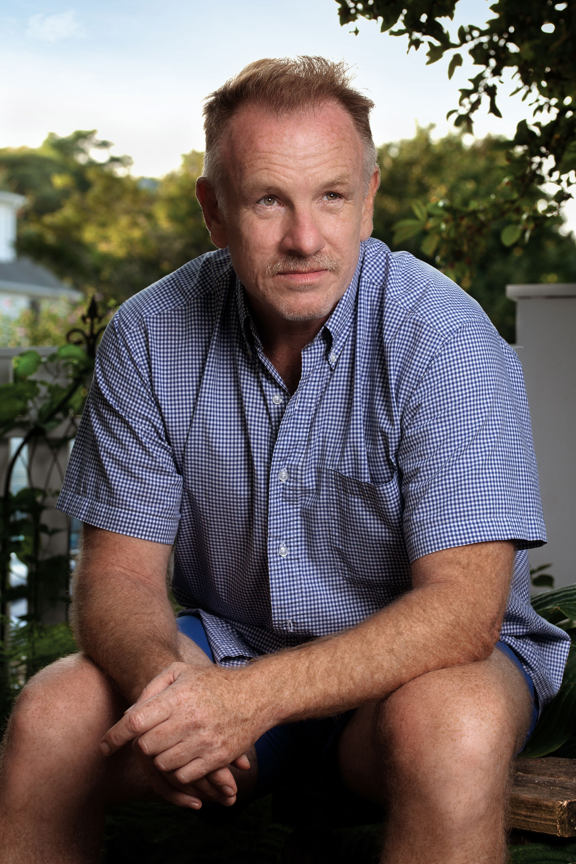 Photo of Jack Pierson seated outside his house in Provincetown